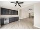 Open living space with custom cabinetry and mini fridge at 17159 Se 78Th Crowfield Ave, The Villages, FL 32162