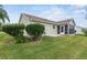 Backyard with mature landscaping and a screened-in porch at 17848 Se 87Th Bourne Ave, The Villages, FL 32162