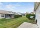 Expansive backyard with a well-maintained lawn, providing ample space for outdoor activities at 17848 Se 87Th Bourne Ave, The Villages, FL 32162