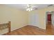 Comfortable bedroom with wood-look flooring, ceiling fan, and closet doors at 17848 Se 87Th Bourne Ave, The Villages, FL 32162