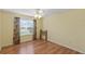 Inviting bedroom boasts bright natural light, ceiling fan, and durable flooring at 17848 Se 87Th Bourne Ave, The Villages, FL 32162