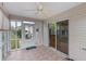 Inviting screened-in patio area with tile flooring and sliding glass doors at 17848 Se 87Th Bourne Ave, The Villages, FL 32162