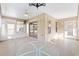 Sunroom with glass windows and ceiling fan at 2128 Westchester Way, The Villages, FL 32162