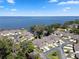 Waterfront townhomes boast serene lake views and well-manicured landscaping in a desirable lakeside community at 2247 Cypress Cove Dr # E2, Tavares, FL 32778