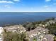 Aerial view of a residential community with waterfront homes and lake access at 2247 Cypress Cove Dr # E2, Tavares, FL 32778