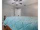 Bedroom with a ceiling fan, spacious closet, and comfortable king size bed at 2247 Cypress Cove Dr # E2, Tavares, FL 32778