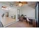Enclosed Florida room featuring a workstation and views of the outdoor area at 2247 Cypress Cove Dr # E2, Tavares, FL 32778