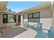 Private brick patio with comfortable seating, providing a relaxing outdoor space with ample natural light at 2247 Cypress Cove Dr # E2, Tavares, FL 32778