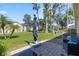 Backyard patio area with comfortable seating and landscaping at 2247 Cypress Cove Dr # E2, Tavares, FL 32778