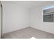 Bright, neutral bedroom with a window that provides plenty of natural light and neutral carpeting at 2884 Supermarine Rd, Tavares, FL 32778