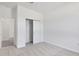 Bedroom with neutral carpet, closet, and doorway at 2884 Supermarine Rd, Tavares, FL 32778