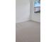 Bedroom featuring neutral carpet, and a large window with outside view at 2884 Supermarine Rd, Tavares, FL 32778