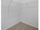 Walk-in closet with carpet flooring and wire shelving for storage at 2884 Supermarine Rd, Tavares, FL 32778