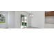 Bright dining room with sliding glass doors leading to patio and backyard at 2884 Supermarine Rd, Tavares, FL 32778