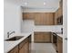 Well-lit kitchen featuring wooden cabinets, stainless steel appliances and light countertops at 2884 Supermarine Rd, Tavares, FL 32778