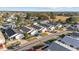 Aerial view of a house with a yard, driveway, and neighboring homes at 2907 Barboza Dr, The Villages, FL 32162