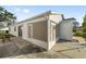 House exterior showcasing a screened-in patio area at 2907 Barboza Dr, The Villages, FL 32162