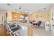 Kitchen features light wood cabinets, breakfast bar and tile flooring at 2907 Barboza Dr, The Villages, FL 32162
