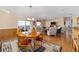 Open living area with seating, hardwood floors and view into kitchen and dining area at 2907 Barboza Dr, The Villages, FL 32162