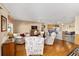 Living room with comfy seating, hardwood floors, and kitchen views at 2907 Barboza Dr, The Villages, FL 32162