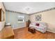 Home office with wood floors, built-in desk and sofa at 2907 Barboza Dr, The Villages, FL 32162