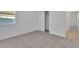 Bedroom with carpet, closet, and neutral walls at 2992 Supermarine Rd, Tavares, FL 32778