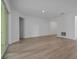 Open-concept layout with light-colored floors and seamless transitions between rooms at 2992 Supermarine Rd, Tavares, FL 32778