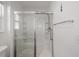 Modern bathroom with a glass-enclosed shower featuring built-in shelving at 320 Zingale Ln, The Villages, FL 32163
