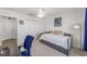Cozy bedroom featuring a gray daybed, ceiling fan, and bright natural light at 320 Zingale Ln, The Villages, FL 32163