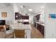 Well-lit kitchen with a breakfast bar, stainless steel appliances, and wood cabinetry at 320 Zingale Ln, The Villages, FL 32163