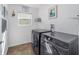 Efficient laundry room with modern appliances and ample lighting at 320 Zingale Ln, The Villages, FL 32163