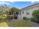 Landscaped backyard with grill and patio, perfect for outdoor entertaining at 3248 Killington Loop, The Villages, FL 32163
