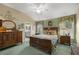 Spacious bedroom with wood furniture and en-suite bathroom access at 3248 Killington Loop, The Villages, FL 32163