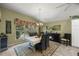 Elegant dining room with a large table and ample natural light at 3248 Killington Loop, The Villages, FL 32163