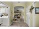 Bright entryway with tile flooring, views to living area and laundry room at 3248 Killington Loop, The Villages, FL 32163