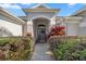 Inviting front entry with a walkway and nicely landscaped area at 3248 Killington Loop, The Villages, FL 32163