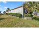 House side showcasing landscaping and exterior features at 3248 Killington Loop, The Villages, FL 32163
