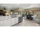 Updated kitchen with breakfast bar, stainless steel appliances, and view to dining area at 3248 Killington Loop, The Villages, FL 32163