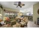 Living room with open concept to kitchen and casual seating at 3248 Killington Loop, The Villages, FL 32163