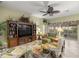 Relaxing living room with built-in entertainment center and access to lanai at 3248 Killington Loop, The Villages, FL 32163