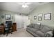 Bright office space with a comfortable couch and built-in desk at 3248 Killington Loop, The Villages, FL 32163