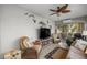 Spacious sunroom with comfortable seating, a TV, and access to the outdoors at 3248 Killington Loop, The Villages, FL 32163