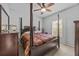 Spacious bedroom with post bed and ceiling fan at 3615 Conroy Rd # 614, Orlando, FL 32839