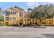 Inviting yellow condo building with ample parking at 3615 Conroy Rd # 614, Orlando, FL 32839