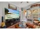 Living room with large TV and access to patio at 3615 Conroy Rd # 614, Orlando, FL 32839