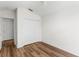Bedroom with double door closet and wood flooring at 3806 Doune Way, Clermont, FL 34711