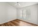 Bright bedroom with wood-look flooring and a ceiling fan at 3806 Doune Way, Clermont, FL 34711