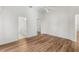 Bedroom with wood floors and an adjacent bathroom at 3806 Doune Way, Clermont, FL 34711
