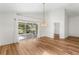 Spacious dining room with wood floors and patio access at 3806 Doune Way, Clermont, FL 34711