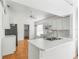 Kitchen with white cabinets, stainless steel appliances and island at 3806 Doune Way, Clermont, FL 34711